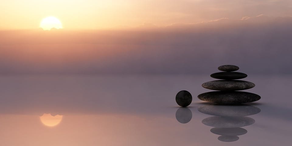 Stones balanced in a photo of sunset